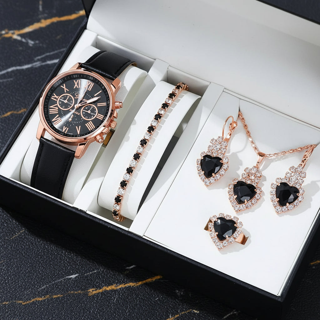 Luxury watch and jewelry set with black and rose gold details in a box.